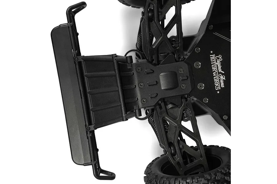 Close-up studio shot of the front suspension, chassis plate, and bumper of the ARRMA MOJAVE 6S RC truck.
