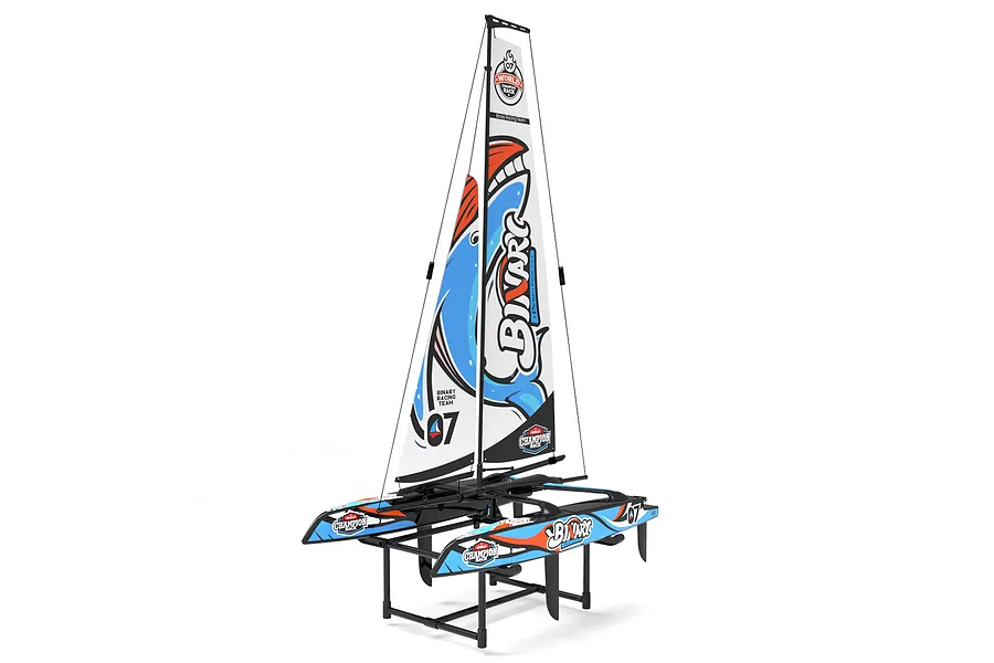 Joysway Binary V3 mini RC catamaran sailboat resting on a black plastic display stand against a white background.
