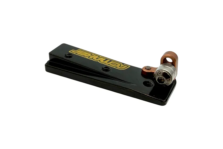 RC Maker rear belt tensioner with bearings featuring a black anodized plate and gold laser-etched logo.