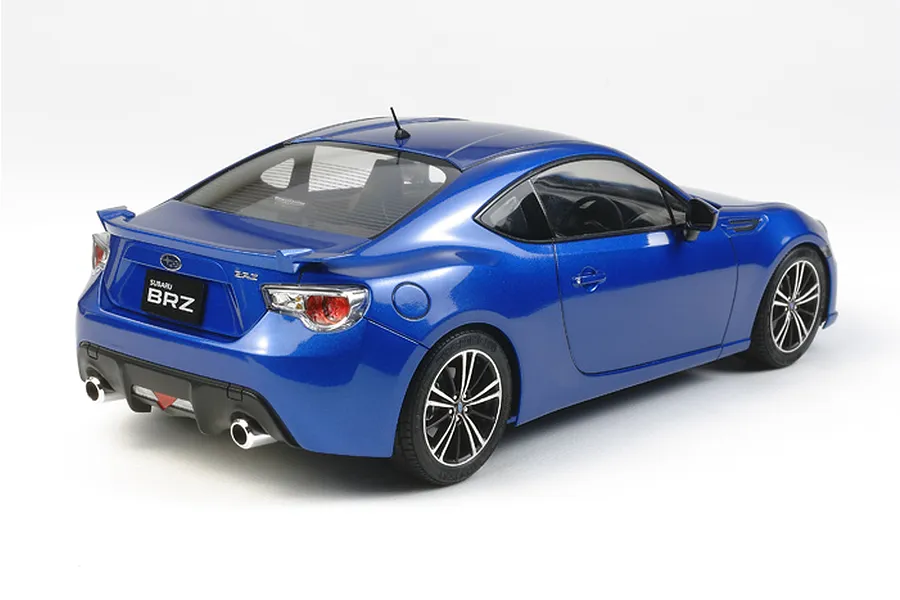 A rear three-quarter view of a blue Tamiya 1/24 scale Subaru BRZ plastic model car kit on a white background.