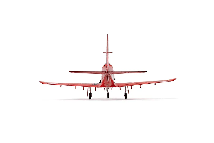 Rear view of the E-Flite Pilatus PC-21 RC airplane in a bright red livery against a clean white background.