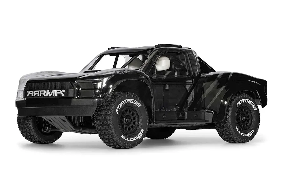 ARRMA Mojave Grom 4X4 RC short course truck in black with off-road tires against a white background.