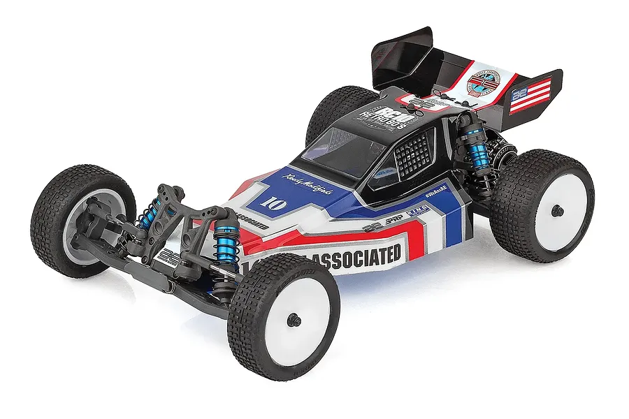 Studio product shot of Team Associated RB10 Retro Kit RC Buggy with red, white, and blue body and white wheels.