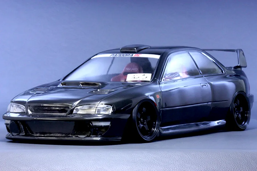 Painted dark grey Pandora RC Subaru Impreza 22B STi body shell mounted on a radio control drift car chassis against a plain background.