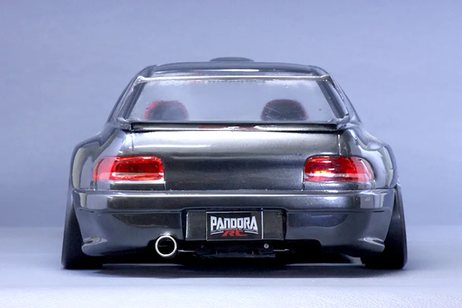 Rear view of a dark grey Subaru Impreza RC drift car body shell featuring a Pandora RC license plate and single exhaust tip.