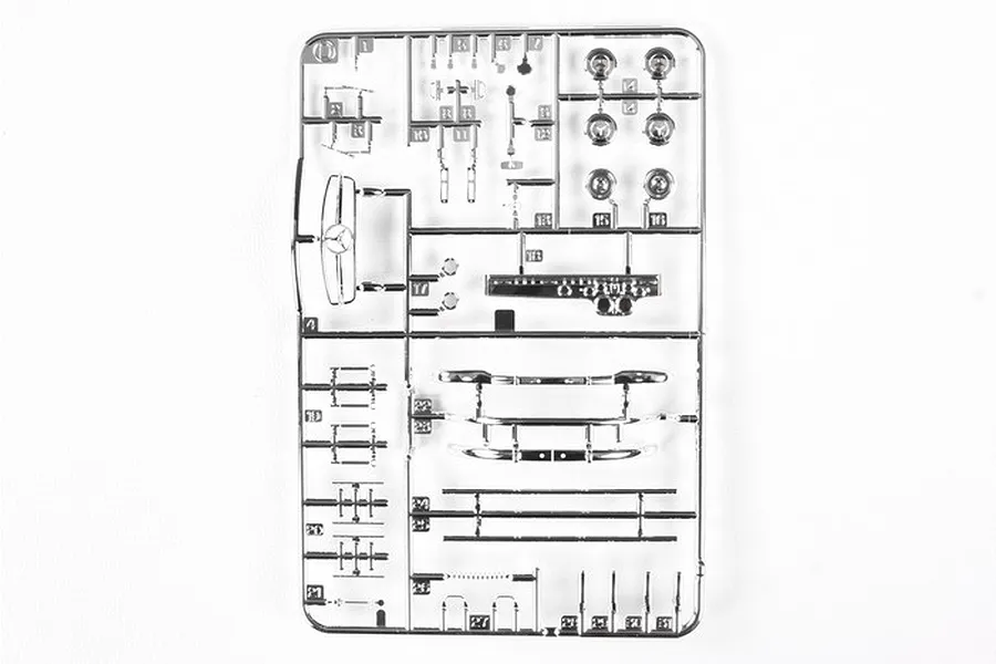 A chrome-plated plastic model kit sprue for a Tamiya 1/24 Mercedes-Benz 300SL, featuring various car parts like bumpers, wheels, and trim.