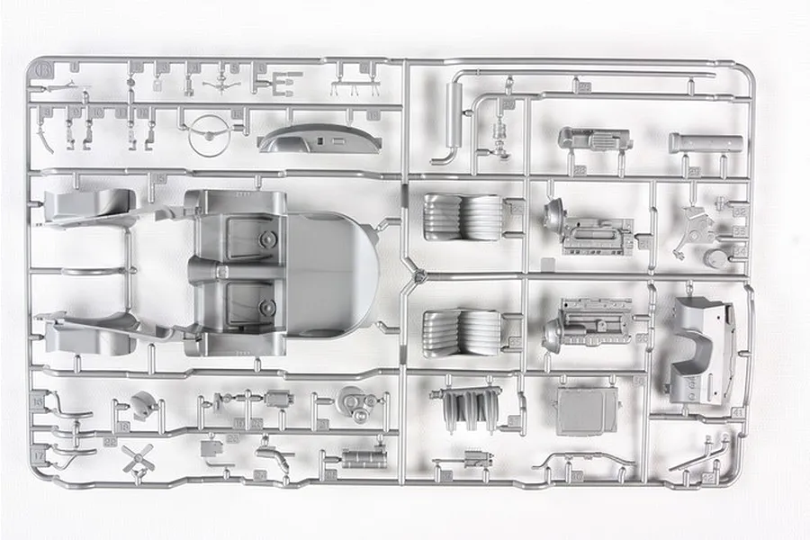A grey plastic sprue from a Tamiya 1/24 scale Mercedes-Benz 300SL model kit, featuring interior parts, engine components, and dashboard pieces.