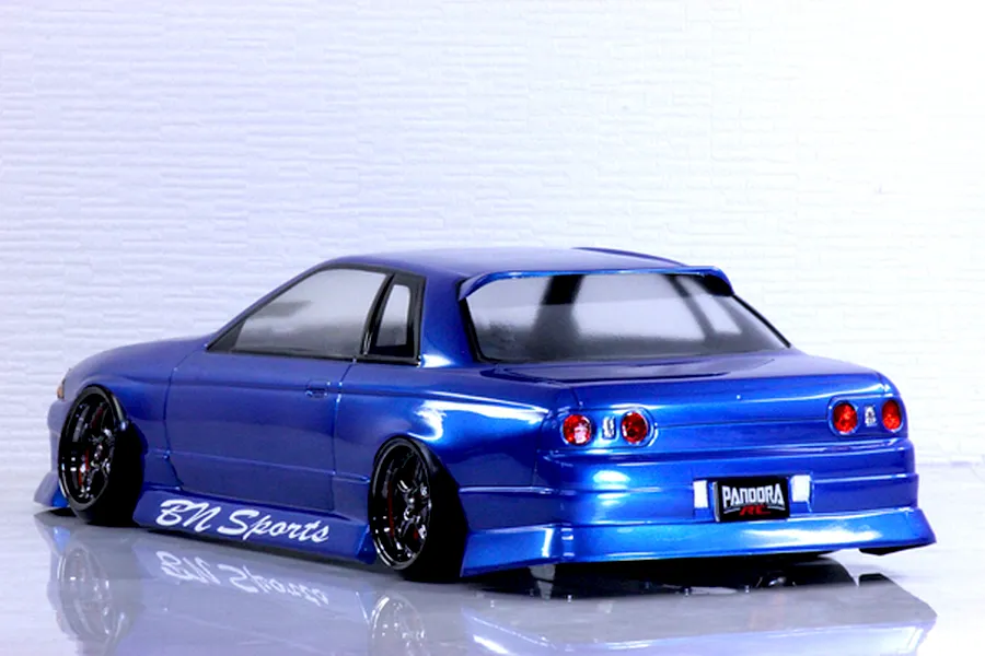 Rear three-quarter view of a blue Pandora RC HCR32 2Dr drift car body shell featuring BN Sports decals and black wheels.