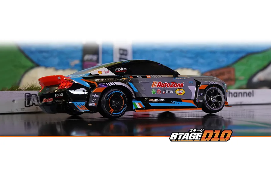 HPI Stage-D10 Ford Mustang GT Spec-5 RC drift car featuring AutoZone livery on an indoor track.