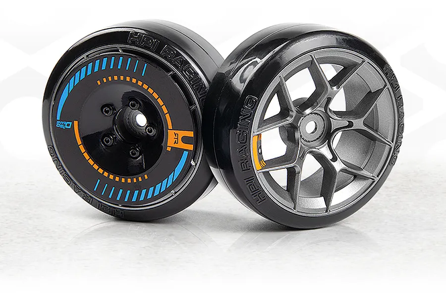 Two 1/10 scale RC drift car wheels and tires with black smooth plastic tyres and detailed rims against a white background.