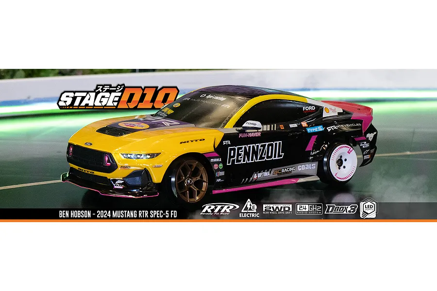 HPI Stage-D10 Ford Mustang GT Spec-5 FD RC drift car in black and yellow livery drifting on a track with smoke.