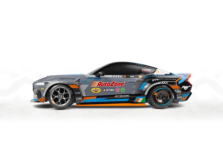 Studio side profile shot of the HPI Stage-D10 Ford Mustang GT Spec-5 FD RC drift car in gray, blue, and black livery.