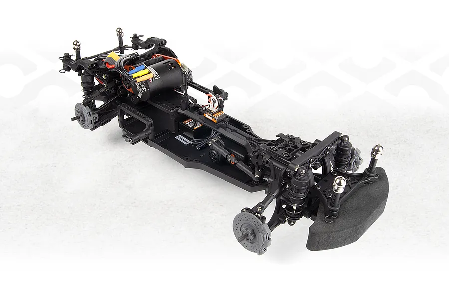 Studio product view of the assembled black composite chassis for the HPI Stage-D10 RC drift car, featuring electric motor, electronics, and suspension without body.
