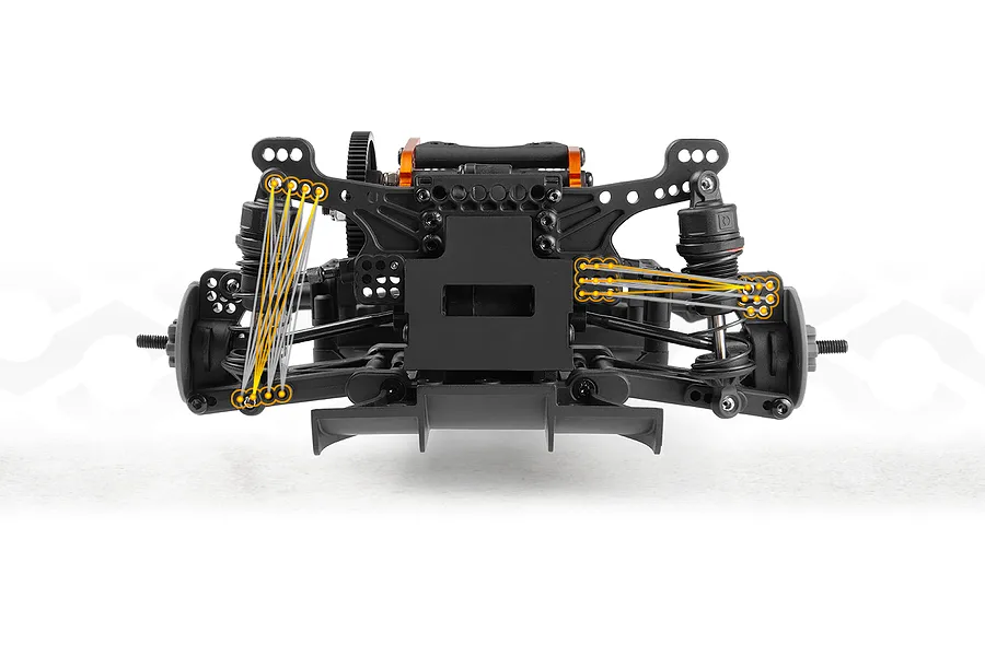 Close-up studio shot of an RC car chassis rear suspension with overlaid orange and grey alignment lines highlighting adjustment points.