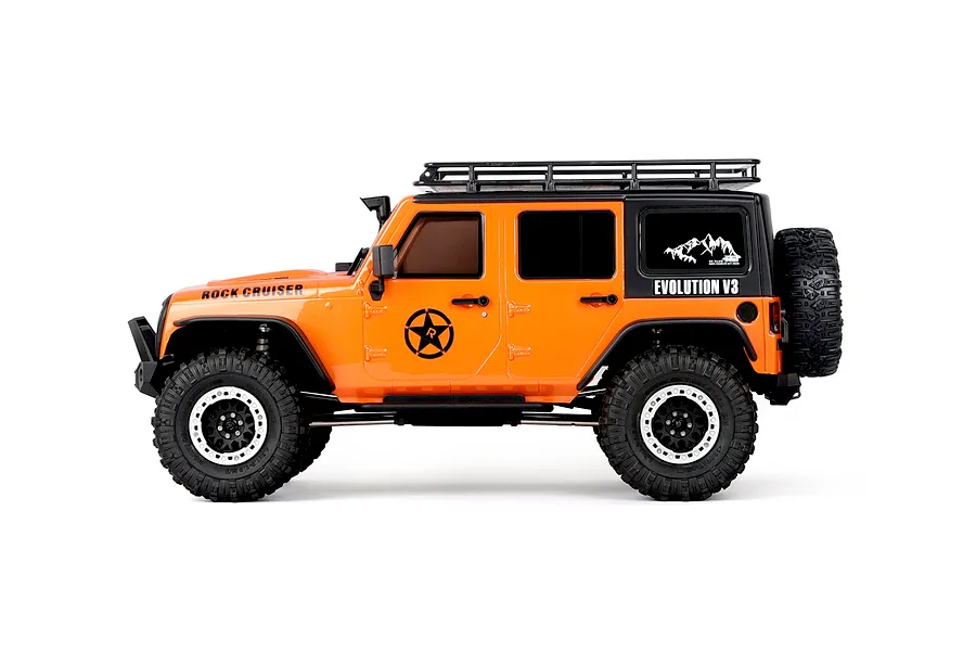 Studio side profile shot of the orange RGT Rock Cruiser Evolution V3 1/10 scale RC rock crawler on a white background.