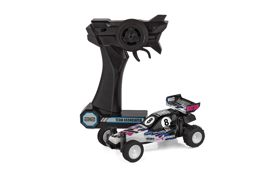 Team Associated RC28 1/28 scale electric RC buggy in Brian Kinwald edition with its black pistol-grip transmitter on white background.