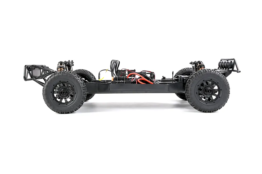 Side profile view of the Rovan ELT320S V2 RC short course truck chassis without body shell, showing black wheels, shocks, and electronics layout on a white background.