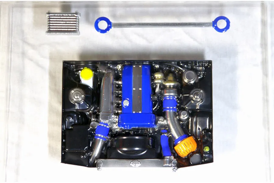 Pandora RC scale model engine set with a blue valve cover, turbocharger, intercooler, and strut bar on a white background.