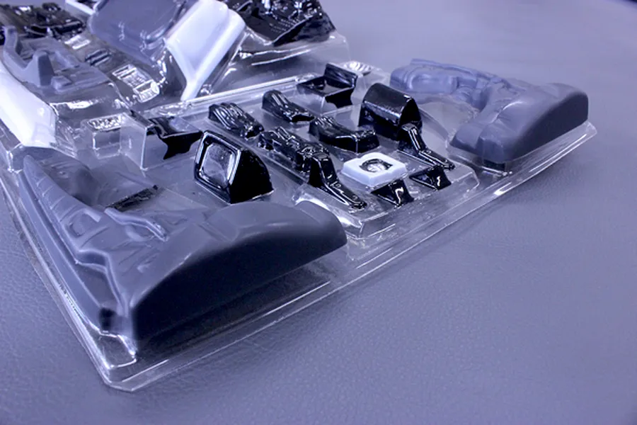 Pandora RC general purpose interior parts set in a clear plastic vacuum-formed blister pack on a grey surface.