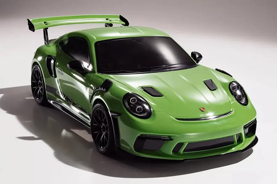 Studio shot of the Kyosho Fazer Mk2 2018 Porsche 911 GT3 RS RC car in lizard green against a white background.