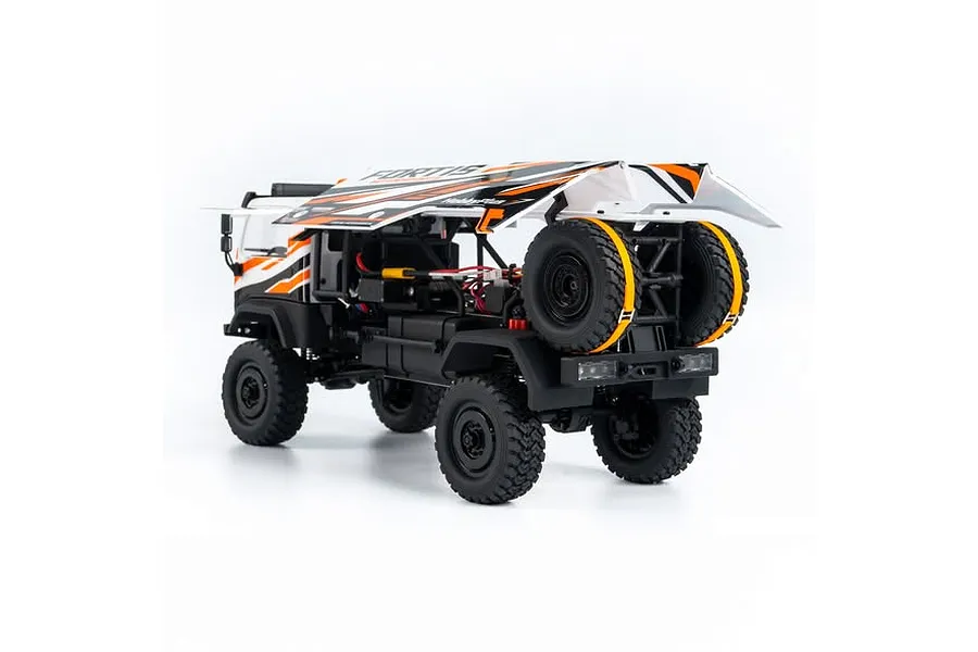 Rear three-quarter view of the HobbyPlus DKR-4 Fortis 1/18 RC desert rally truck in white with orange graphics, showing the hinged body open.
