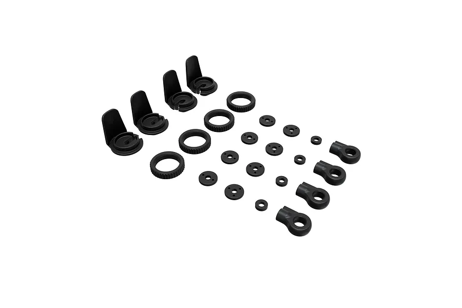 Arrma composite shock parts set for Mini Kraton laid out on a white background, showing plastic shock caps, collars, pistons, and rod ends.