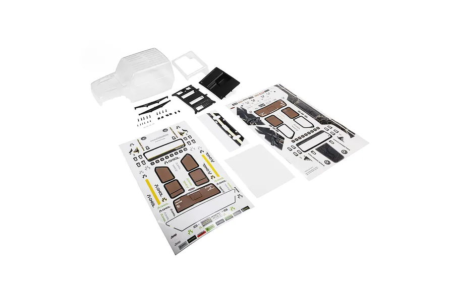 Axial clear Jeep JT Gladiator body set laid out with black plastic accessories, window masks, and sticker sheets on a white background.