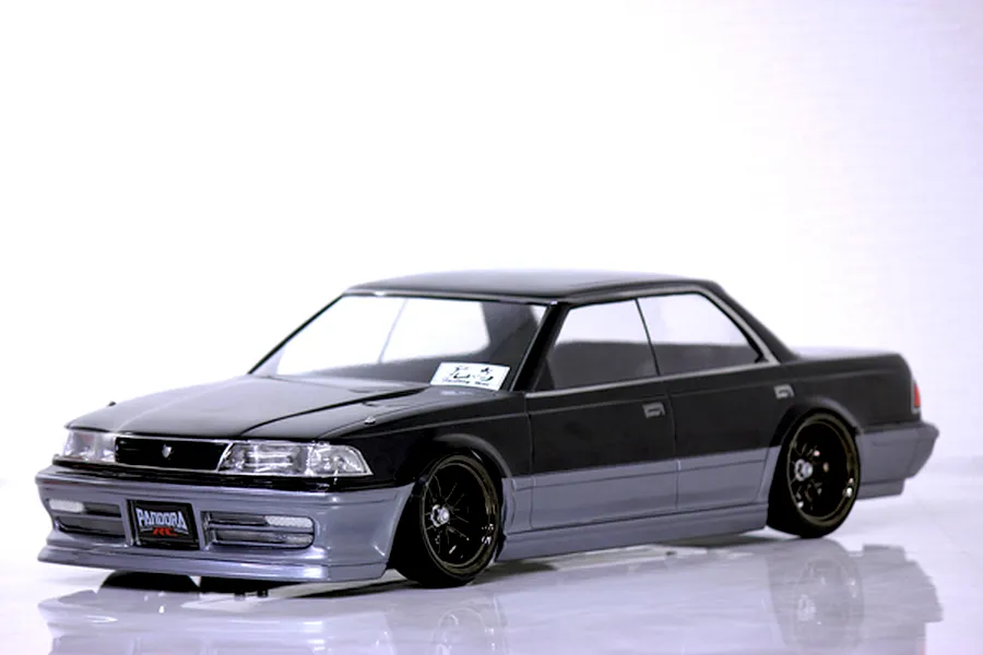 A painted Pandora RC Toyota Mark2 JZX81 drift body shell mounted on an RC chassis against a white background.