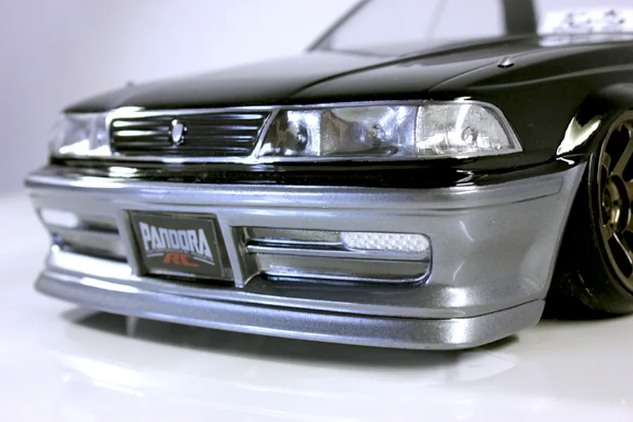 Close-up front view of the Pandora RC Toyota Mark 2 JZX81 body shell in black and silver on a white background.