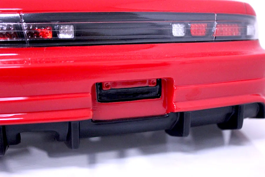 Close-up rear view of the red Pandora RC S14 Silvia late model body shell showing tail lights, rear bumper, and black diffuser.