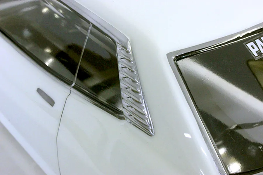 Close-up of the rear quarter window and louver detail on the Pandora RC Toyota Celica 1600GT body shell.