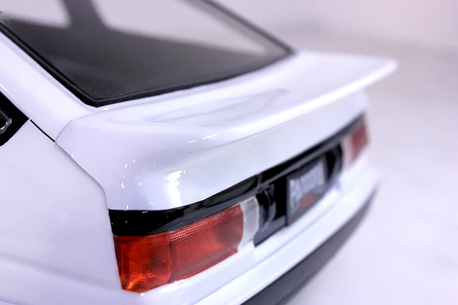 Close-up of the rear spoiler and taillight section of a white Pandora RC Toyota AE86 Sprinter Trueno body shell.