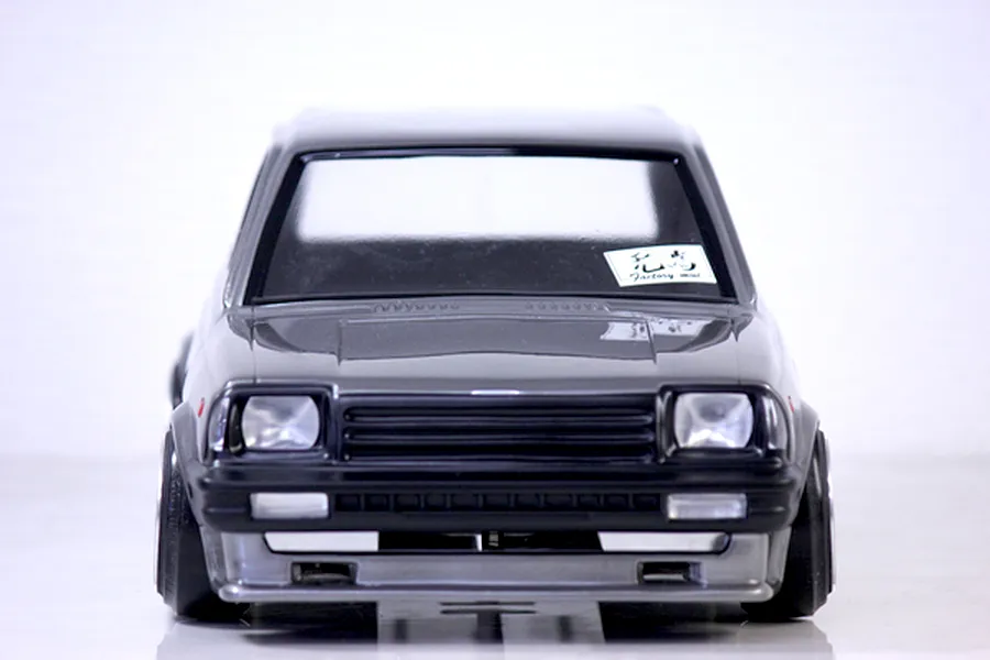 Front view of the Pandora RC Toyota Starlet KP61 RC body shell in grey and black against a plain white background.