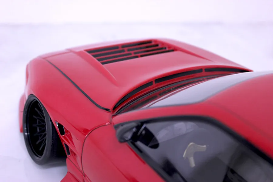 Close-up of the red bonnet and vented hood of the Pandora RC RPS13 180SX drift car body shell.