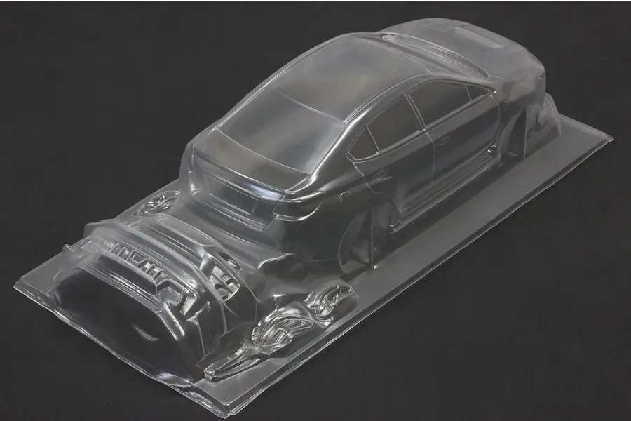 Unpainted clear RC car body shell of a sedan on a dark background.