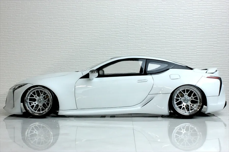 Side profile view of a white Pandora RC Lexus LC 7800 body shell fitted to a radio-controlled drift car with custom chrome wheels.