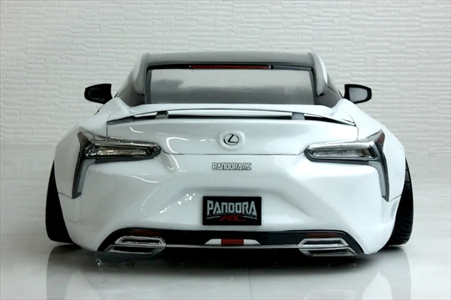 Rear view of a Pandora RC Lexus LC 7800 body shell painted white with black roof, custom decals, and detailed tail lights.
