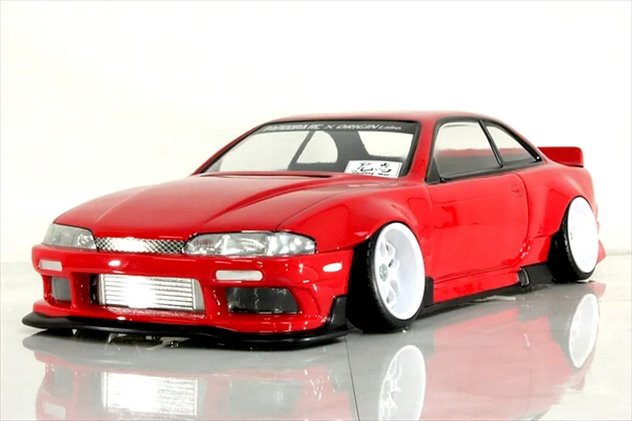Red Pandora RC S14 Silvia early model with Origin Labo styling, wide fenders, and white drift wheels on a reflective surface.