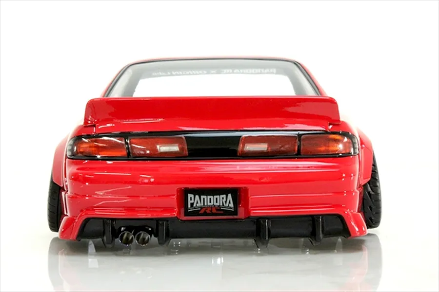 Rear view of a red RC drift car body shell, showing taillights, rear spoiler, dual exhaust pipes, and a Pandora RC license plate against a white background.