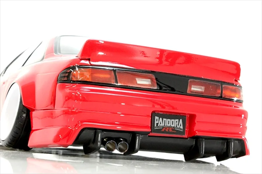 Rear-end view of a red Pandora RC S14 Silvia body shell featuring a rear spoiler, diffuser, and dual exhaust tips.