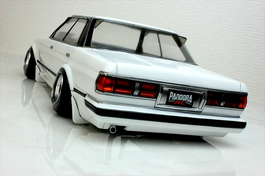 Rear view of a white Pandora RC Toyota Mark 2 GX71 drift model car body shell showing wide stance wheels, taillights, and Pandora license plate.