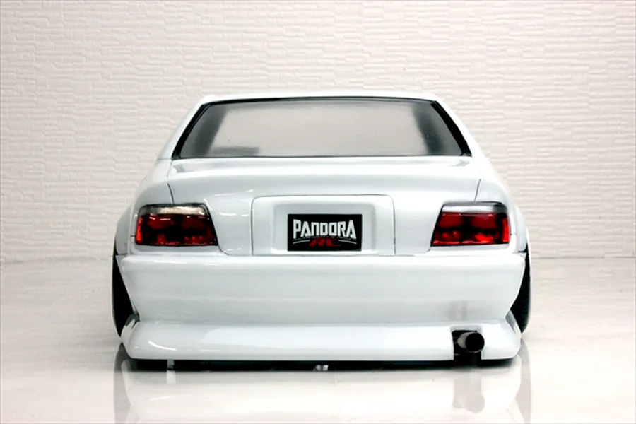 Rear view of a white RC drift car body shell showing tail lights, exhaust pipe, and Pandora RC license plate against a light background.