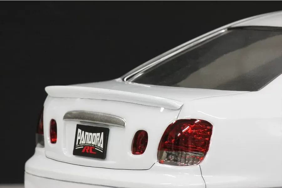 Rear close-up view of the white Pandora RC Toyota Aristo JZS161 body shell showing the trunk, taillights, and spoiler.