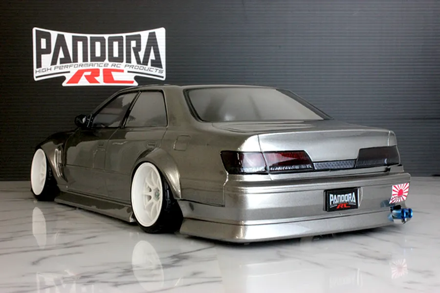 Rear three-quarter view of a metallic grey Toyota Mark II RC drift car body shell with white wheels and Pandora RC branding.