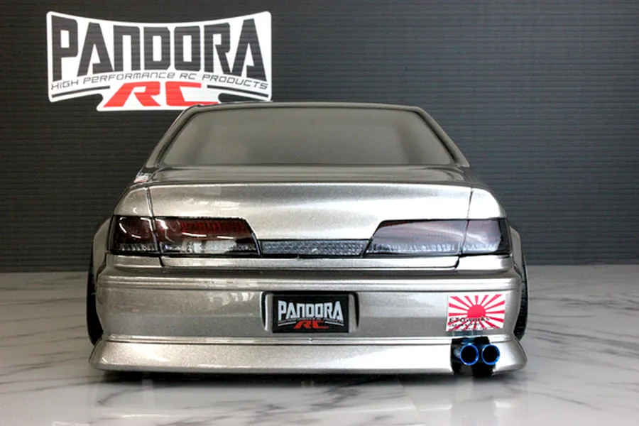 Rear view of a silver Pandora RC Toyota Mark2 JZX100 body shell showcasing dark tail lights, dual exhaust tips, and Pandora branding.