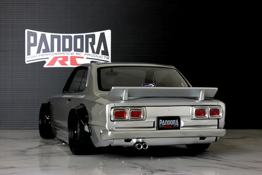 Rear view of a silver Pandora RC KPGC10 Skyline Hakosuka drift RC body shell with spoiler and black fender flares.