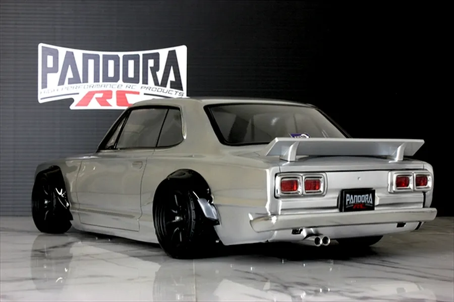 Rear three-quarter view of the Pandora RC KPGC10 Skyline HT 2000GT-R body shell painted silver with black fender flares.