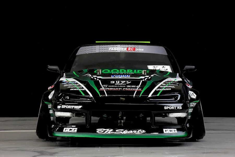 Front view of a Pandora RC S14 Silvia RC drift car body featuring black and green livery with sponsor decals.