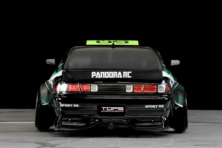 Rear view of a black Pandora RC S14 Silvia remote control drift car featuring wide fenders and sponsor decals.