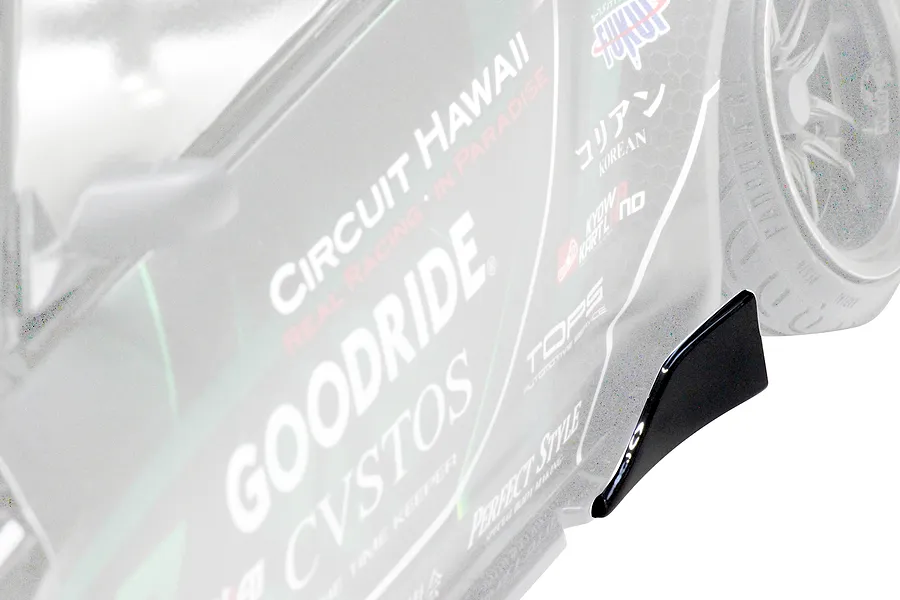 Close-up of a Pandora RC S14 Silvia RC drift car body showing side sponsor decals and a black side skirt winglet.